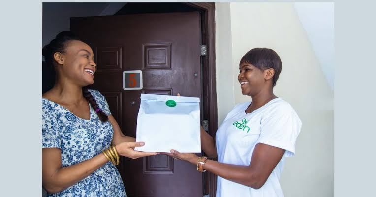 Eden Life Nigeria staff delivering to client